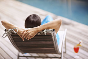 homeowner relaxing at pool